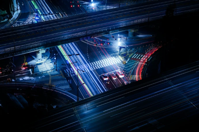 an aerial view of a city street at night